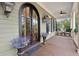 Covered porch features seating area with ceiling fan and stylish decor at 2217 Beckenham Dr, Mount Pleasant, SC 29466