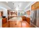 Well-equipped kitchen with wood cabinetry, an island with seating, and modern stainless steel appliances at 2710 Gnarled Pine, Seabrook Island, SC 29455