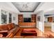 Open living room with hardwood floors, built-in cabinets, and lots of natural light at 2710 Gnarled Pine, Seabrook Island, SC 29455