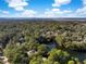 Aerial view of a waterside neighborhood featuring a lake and woods at 2824 Old Drake Dr, Seabrook Island, SC 29455