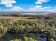 Aerial view of a waterside neighborhood featuring a lake and marshland at 2824 Old Drake Dr, Seabrook Island, SC 29455