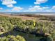 Aerial view of a neighborhood and lake with arrow pointing to the home at 2824 Old Drake Dr, Seabrook Island, SC 29455