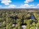 Aerial view of a neighborhood with water, woods, and houses at 2824 Old Drake Dr, Seabrook Island, SC 29455