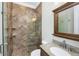 Bathroom featuring tiled shower, granite counter, and framed mirror at 2824 Old Drake Dr, Seabrook Island, SC 29455