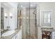 Stylish bathroom shower with glass enclosure, tiled walls, rainfall shower head, and decorative ladder-style towel rack at 2824 Old Drake Dr, Seabrook Island, SC 29455
