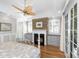Cozy bedroom with a decorative fireplace, hardwood floors, and natural light at 2824 Old Drake Dr, Seabrook Island, SC 29455