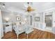 Bright bedroom with elegant wainscoting, hardwood floors, and ample natural light at 2824 Old Drake Dr, Seabrook Island, SC 29455