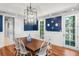 Bright dining room with hardwood floors, blue accent wall, and elegant details at 2824 Old Drake Dr, Seabrook Island, SC 29455