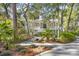 A charming home with a welcoming front porch and a beautifully landscaped yard at 2824 Old Drake Dr, Seabrook Island, SC 29455