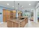 Open kitchen with granite countertops, pendant lights, and seamless access to living spaces at 2824 Old Drake Dr, Seabrook Island, SC 29455