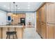 Gourmet kitchen featuring custom cabinetry, stainless appliances, and a center island with seating at 2824 Old Drake Dr, Seabrook Island, SC 29455