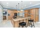 Spacious kitchen with a large island, modern lighting, and stainless steel appliances at 2824 Old Drake Dr, Seabrook Island, SC 29455