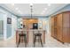 Open kitchen with granite countertops, pendant lights and bar stool seating at 2824 Old Drake Dr, Seabrook Island, SC 29455
