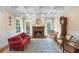 Charming living room boasts coffered ceilings, fireplace, and access to outdoor spaces at 2824 Old Drake Dr, Seabrook Island, SC 29455