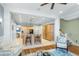 Open-concept living area with built-in cabinets, hardwood floors, and seamless access to the kitchen at 2824 Old Drake Dr, Seabrook Island, SC 29455