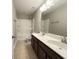 Neutral toned bathroom featuring a double sink vanity and shower-tub combo at 3072 Adventure Way, Ladson, SC 29456