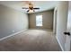 Cozy bedroom with neutral carpet, bright window, and a ceiling fan at 3072 Adventure Way, Ladson, SC 29456