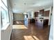 Open concept kitchen featuring hardwood floors, granite countertops, stainless steel appliances, and a kitchen island at 3072 Adventure Way, Ladson, SC 29456