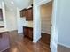 View of the kitchen featuring hardwood floors, dark cabinets, granite countertops, and a pantry at 3072 Adventure Way, Ladson, SC 29456