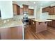 View of the kitchen featuring dark cabinets, stainless steel appliances, granite countertops, and a kitchen island at 3072 Adventure Way, Ladson, SC 29456