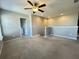 Cozy loft area featuring neutral carpet, an open layout, and easy access to laundry at 3072 Adventure Way, Ladson, SC 29456