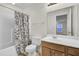 Bright bathroom with a shower-tub combo, white tiles, and a wood vanity at 315 Bradley Bend Dr, Moncks Corner, SC 29461
