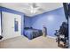 Vibrant blue bedroom with a ceiling fan, carpet, and a closet with a mirrored door at 315 Bradley Bend Dr, Moncks Corner, SC 29461