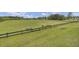 Expansive community green space with picnic tables and fencing, perfect for outdoor activities at 315 Bradley Bend Dr, Moncks Corner, SC 29461