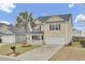 Charming two-story home featuring a palm tree, black shutters, a front porch, and a two-car garage at 315 Bradley Bend Dr, Moncks Corner, SC 29461