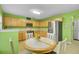 Eat-in kitchen with stainless steel appliances, light wood cabinets, and a view of the backyard at 315 Bradley Bend Dr, Moncks Corner, SC 29461