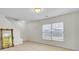 Bright living room with large windows and carpeted flooring, next to staircase and featuring a stylish mirror at 315 Bradley Bend Dr, Moncks Corner, SC 29461