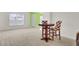 Open living space with neutral carpet and a decorative table with chairs at 315 Bradley Bend Dr, Moncks Corner, SC 29461