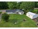 An elevated view of the house, outbuilding, and attached garage on a generous lot at 3657 Santee River Rd, Saint Stephen, SC 29479
