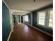Inviting living room with stained hardwood floors, freshly painted walls and generous natural light at 3657 Santee River Rd, Saint Stephen, SC 29479