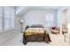 Comfortable bedroom featuring white walls, carpet, window shutters, and a decorative blanket on the bed at 379 Oak Park St, Summerville, SC 29486