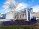 Exterior view of home featuring a screened in porch and professional landscaping at 3933 Bessemer Rd, Mount Pleasant, SC 29466