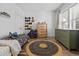 Cozy bedroom featuring a circular rug, window, and cute decor at 3933 Bessemer Rd, Mount Pleasant, SC 29466