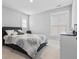 Bright bedroom features a large window, comfortable bed, and neutral decor, creating a relaxing atmosphere at 3933 Bessemer Rd, Mount Pleasant, SC 29466