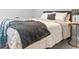 Cozy bedroom with a soft carpet and neutral decor features a comfortable-looking bed with blankets and pillows at 3933 Bessemer Rd, Mount Pleasant, SC 29466