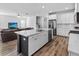 View of the island showing the sink, barstool seating and open view to the living area at 3933 Bessemer Rd, Mount Pleasant, SC 29466