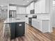 Well-equipped kitchen with white cabinetry, stainless steel appliances, and a center island for meal prep at 3933 Bessemer Rd, Mount Pleasant, SC 29466