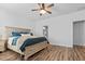 Comfortable main bedroom featuring a ceiling fan, neutral paint, and hardwood flooring at 3933 Bessemer Rd, Mount Pleasant, SC 29466