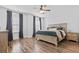 Comfortable main bedroom featuring a ceiling fan, neutral paint, and hardwood flooring at 3933 Bessemer Rd, Mount Pleasant, SC 29466