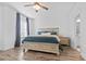 Comfortable main bedroom featuring a ceiling fan, neutral paint, and hardwood flooring at 3933 Bessemer Rd, Mount Pleasant, SC 29466