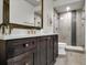 Beautiful bathroom features a dark wood vanity and glass shower at 3949 Bulow Landing Rd, Ravenel, SC 29470