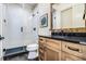 Modern bathroom boasts a glass-enclosed shower and elegant wood vanity at 3949 Bulow Landing Rd, Ravenel, SC 29470
