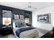Stylish bedroom with blue accents and unique artwork on the walls at 3949 Bulow Landing Rd, Ravenel, SC 29470