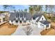 Picturesque two-story house features a three-car garage and sprawling front yard complemented by a concrete driveway at 3949 Bulow Landing Rd, Ravenel, SC 29470