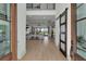 Welcoming foyer with an open floor plan, light hardwood floors, and a view into the living and dining areas at 3949 Bulow Landing Rd, Ravenel, SC 29470