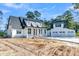 Gorgeous front exterior with a large driveway and a spacious three car garage at 3949 Bulow Landing Rd, Ravenel, SC 29470